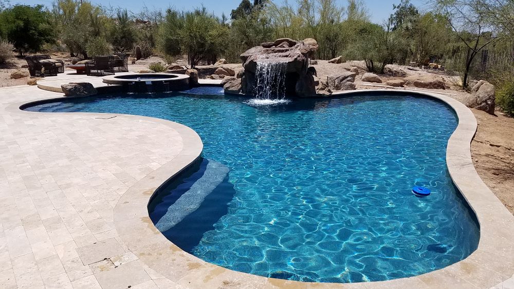 Custom concrete swimming pool built by Saturn Pool Company in Arizona